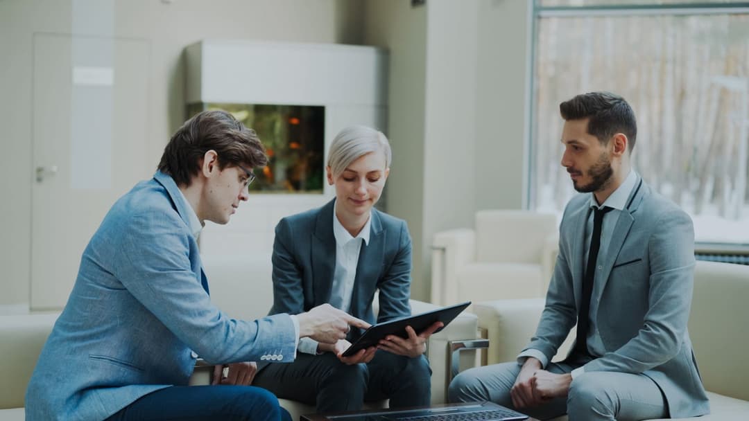 Professional consulting team collaborating in a modern office workspace